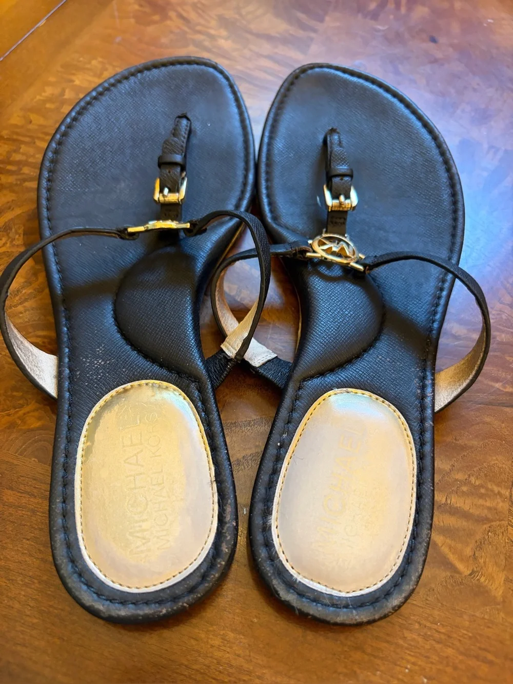 Michael Kors Black Leather T-Strap Sandals with Gold MK Medallions